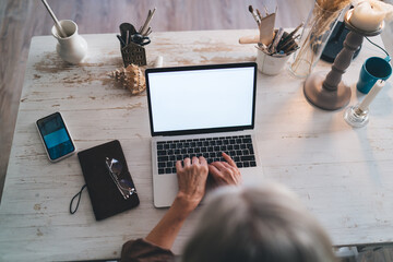 Female entrepreneur working at table at art studio