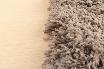 Gray chenille soft bath mat texture background. Bath Accessories. Top view.
