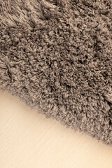 Gray chenille soft bath mat texture background. Bath Accessories. Top view.