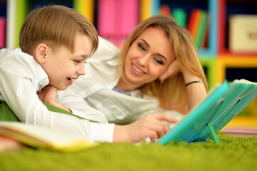 Mother with her son doing homework at home