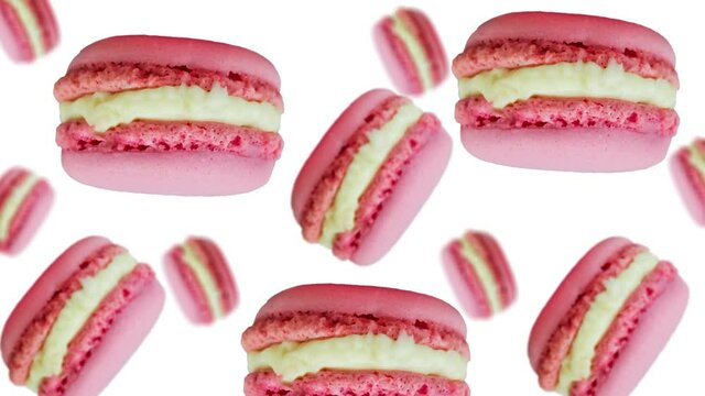 Sweet pink color macaroons flying and wiggle on a white color background. French Macarons cookie is a sweet meringue-based confection. Valentines day, Date, Wedding, Love gift. Romantic love concept 
