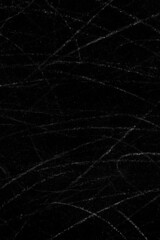 White dust particles and scratch lines on a black concrete wall surface for background