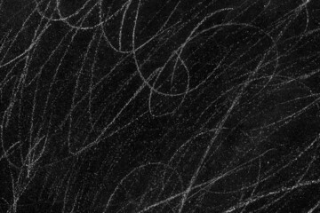 White scratches on rough black concrete wall surface for texture background