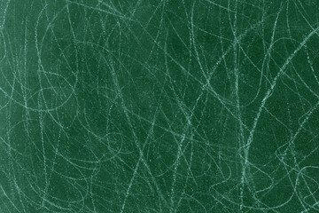 Dark green color rough concrete wall surface with random white scratch lines for texture background