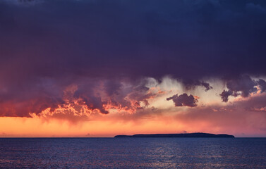 Fototapeta na wymiar heavy clouds sunset over the sea
