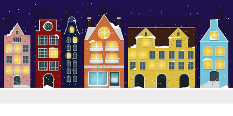 Nordic houses on a snowy night with a burning light in the windows. 
