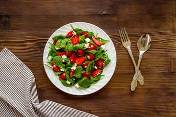 Healthy spinach salad with strawberry. Vegetarian lunch