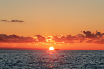 Sunset on the Mediterranean. The solar disk over the water surface.