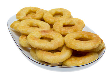Fried calamari rings on plate isolated on white background