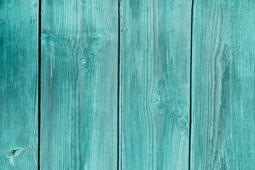 A beautiful wooden background in blue with a well-visible texture.
