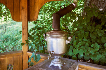 Traditional Russian  with a pipe on the summer veranda.
