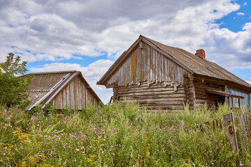 Abandoned traditional old wooden house. Summer view.