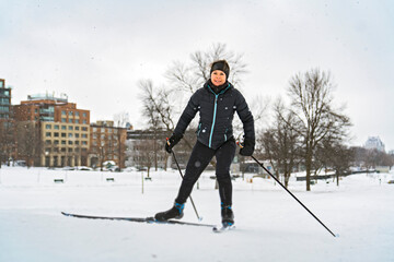 Woman cross country skiing on a winter morning in