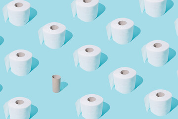 Toilet paper rolls on blue pastel background. Stomach upset. Toilet paper rolls pattern. Global Corona virus pandemic. Isolation mood. WC minimalism. Flat lay. Bathroom minimal concept.