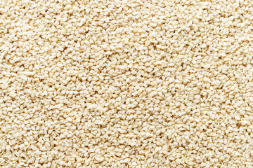 Sesame seeds as background. Flat lay, copy space