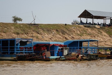 Colourful wooden boats at the shore of Lake Tonle Sap, Siem Reap, Cambodia