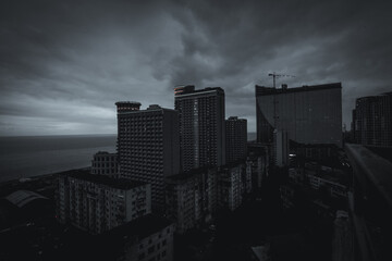 Black and white panorama of the night city. Skyscrapers. Urbanism. Night Batumi.