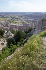 Pinnacles Overlook in Badland national park during summer. From grassland to valley. Badland landscape South Dakota.