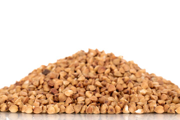Uncooked organic buckwheat, macro, isolated on white.