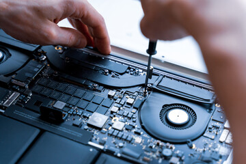 Pc repair service. Computer technician service with laptop on hardware technology background. Maintenance engineer support. Engineer fixing broken computer motherboard.