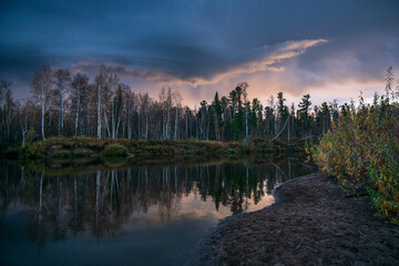beautiful sunset in the taiga with a river
