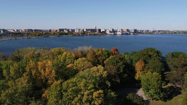 Downtown Madison in Fall - Lowering Behind Fall Colored Trees in Olin Park (Drone - High to Low)