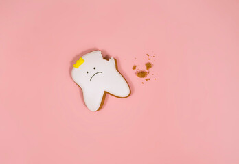 gingerbread in the shape of a tooth, background for the concept of pediatric dentistry and tooth...