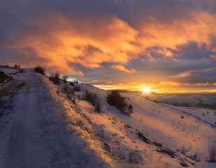 Beautiful Winter Sunset in a Snowy Landscape