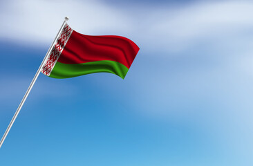 Flag of the Belarus on a stick, clear sky in the background