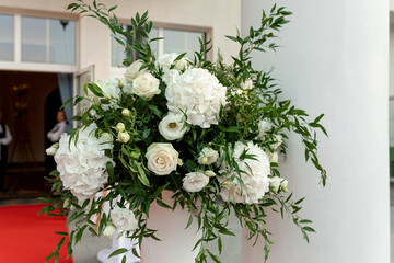 Close up of floristic composition - gorgeous bouquet of white roses, green eucalyptus leaves and...