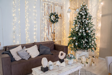 Christmas morning interior with christmas tree scandinavian loft. White and gold balls on the Christmas tree. 