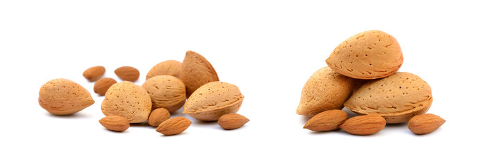 Heap of fresh almonds in shells isolated on white background