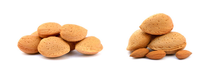 Heap of fresh almonds in shells isolated on white background