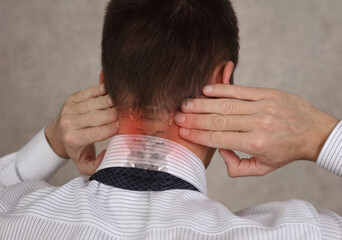 Business man suffering from neck pain. Pain relief concept