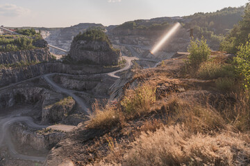 Dolomite quarry Photo from above. Industrial terraces in a quarry. Aerial view of open pit mining. Excavations of the Dolomite mine. Mining industry.