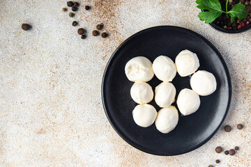 mozzarella small balls cow's milk or buffalo, goat healthy meal food snack on the table copy space food background rustic top view