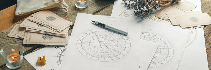 Astrology. Astrologer calculates natal chart and makes a forecast of fate Tarot cards, Fortune...