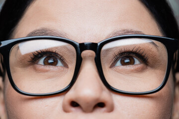 cropped view of asian woman in eyeglasses, eye care concept.
