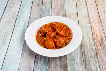 the meatballs in sauce with peas, peppers and vegetables are a delight and a wild card that we can batter to freeze and always have on hand