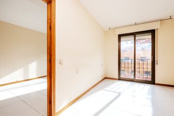apartment room with bay window and white ceramic floors