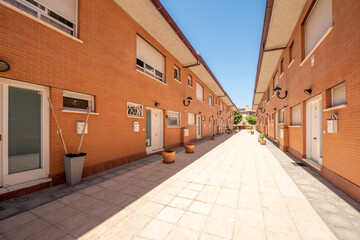 Walk between single-family homes showing an interesting vanishing point