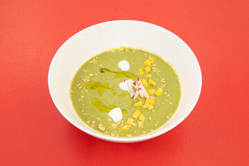 Green gazpacho with avocado, wasabi, sweet corn and fresh cheese Green gazpachos made from coriander and tomato are very popular
