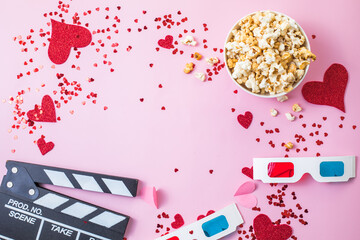 St. Valentine's day Movie night concept. Popcorn, 3d glasses clapper board on pink  background....