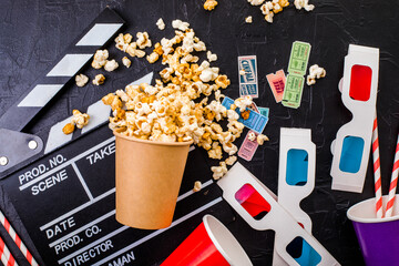 Movie tickets, soda drink plastic straws and popcorn . Home theatre movie or series night concept. Flat lay top view from above with copy space.