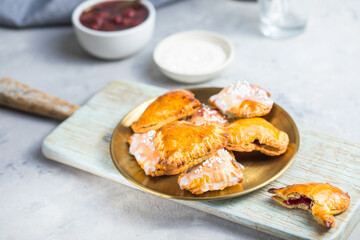 Strawberry heart pop tarts, shot from the top on a  concrete  background. Tasty toaster pastry