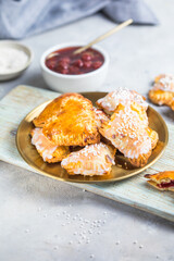 Strawberry heart pop tarts, shot from the top on a  concrete  background. Tasty toaster pastry