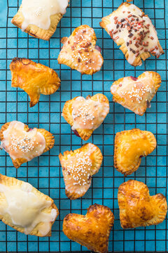 Strawberry Heart Pop Tarts, Shot From The Top On A  Concrete  Background. Tasty Toaster Pastry