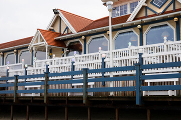 Wooden houses built on high stilts, on the seashore.