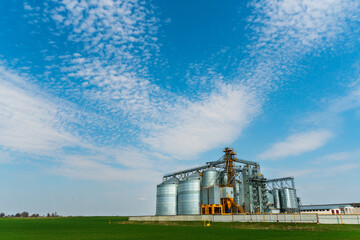 A large modern plant for the storage and processing of grain crops. view of the granary on a sunny...