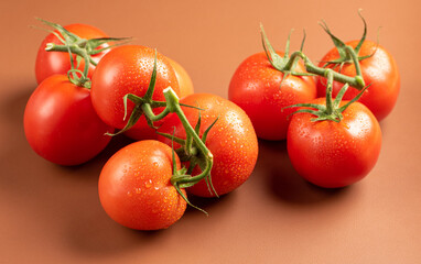 Tomatoes, beautiful tomatoes in details arranged on a brown leather, selective focus.